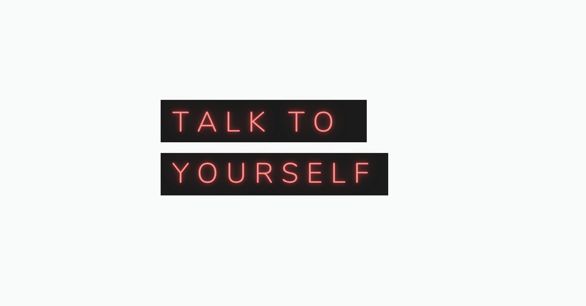 Neon sign reading "Talk to Yourself" — self-talk technique for learning English